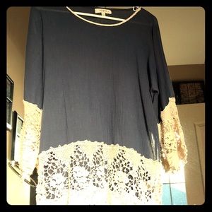 Blue flowy blouse with cream crochet ends